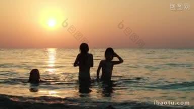 三个女孩在日落的海上玩球，儿童活动和暑假